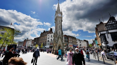 Leicester city centre filled with shoppers, the clock tower in the middle