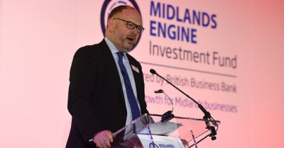a man talks at a podium at the midlands engine investment fund