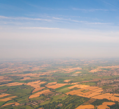 wide angle view of the British landscape featuring a lot of fields